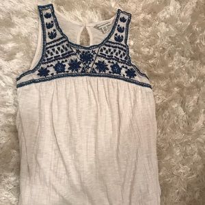 White top with blue stitching